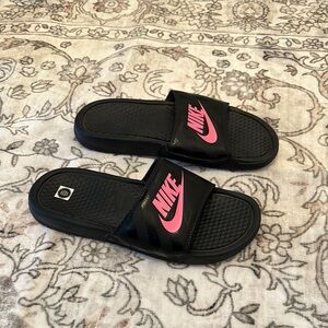 Nike womens black slides size 6. New without tags. Pink accents